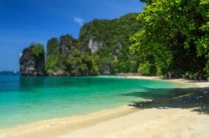 “Tourist photographing turquoise waves at Radhanagar Beach, Andaman Nicobar”